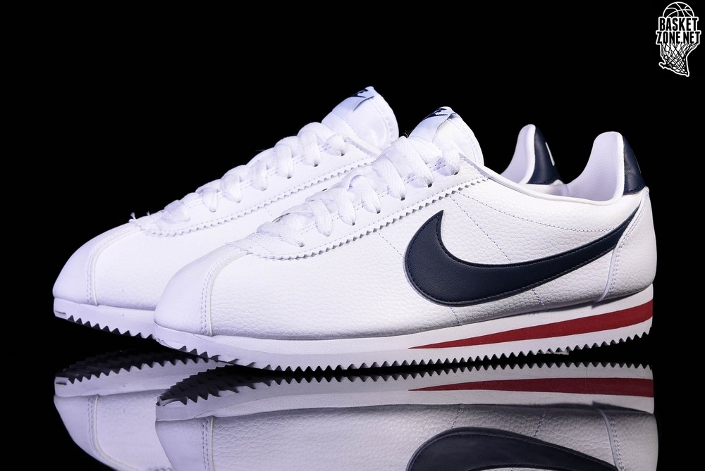 navy blue and white cortez